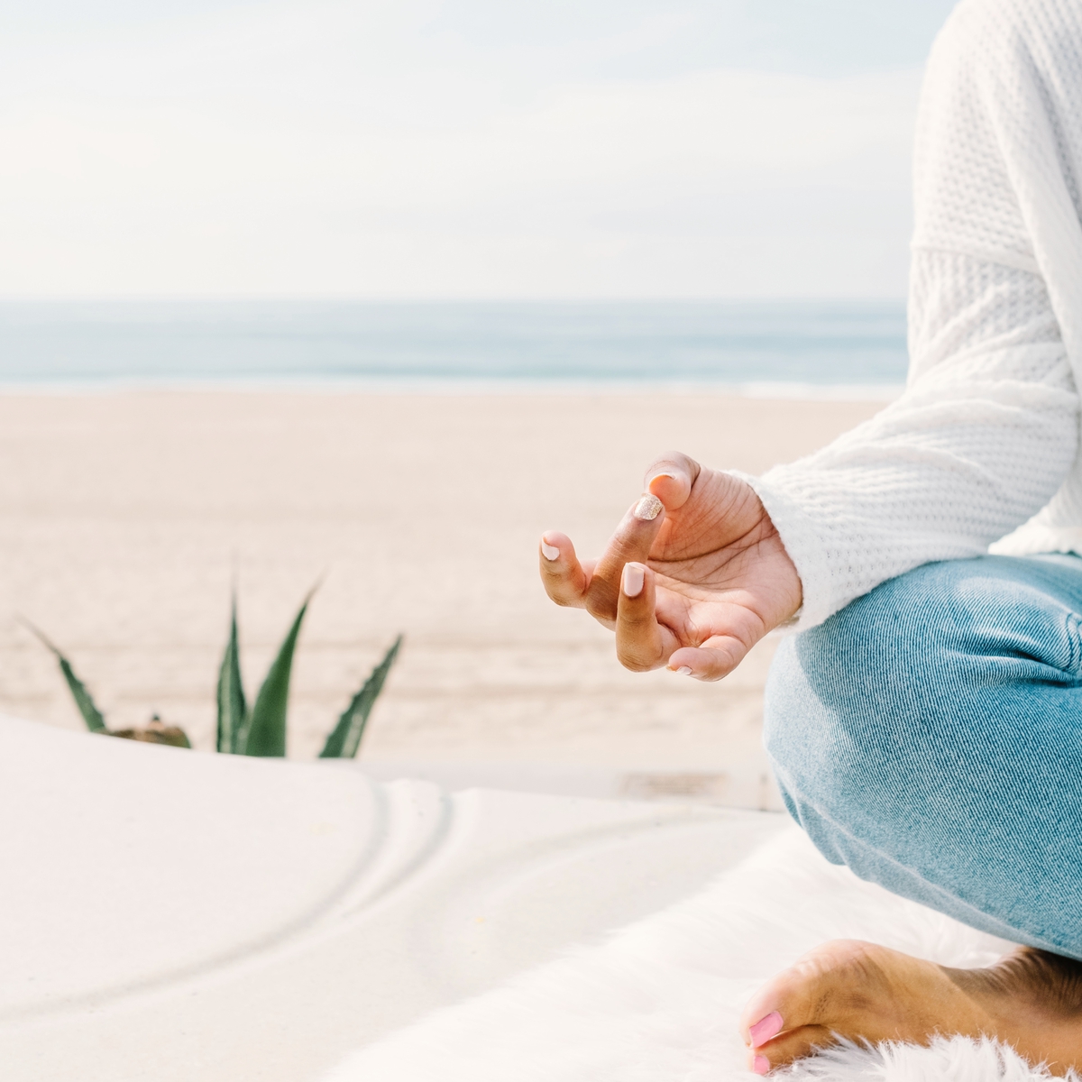 woman sitting on beach
